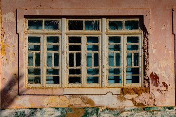 Broken window in the ghost town  of Bolama, the former capital of Portuguese Guinea