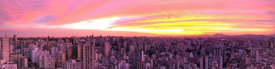 Fototapeta premium Panoramic view of cityscape. Sunset view in the urban city. Great cityscape. Sunset view in the urban city. Colored skyline. Great cityscape. Sunset view in the urban city. Colored skyline.