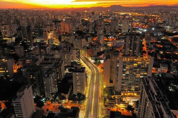 Sunset view. Urban city life scene. Illuminated cityscape. Urban city life scene. Illuminated cityscape. Sunset view. Urban city life scene. Illuminated cityscape. Sunset view in Sao Paulo, Brazil.