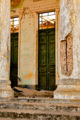 Fototapeta na wymiar Close view of the abandoned ruins of former administration building of Bolama, the former capital of Portuguese Guinea