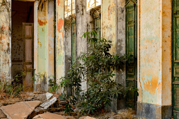 Fototapeta na wymiar Close view of the abandoned ruins of former administration building of Bolama, the former capital of Portuguese Guinea