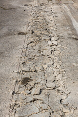Broken Road crack Texture. After Construction drilled surface with jackhammer. Concrete broken from...