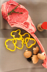 Tomahawk steak with mushrooms and cherry 