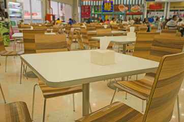 A little bit customer and empty chairs in food shop