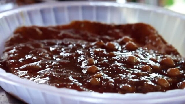 Fried Indian bread kulcha dipped in chana chole.