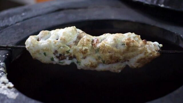 Chicken Reshami Tikka. Barbecued chunks of boneless chicken marinated with beaten egg cooked in an Indian tandoor or clay pot.