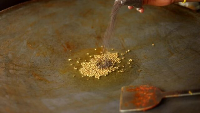 Making indian red gravy stuffing with peas for vada pav and bhaji.