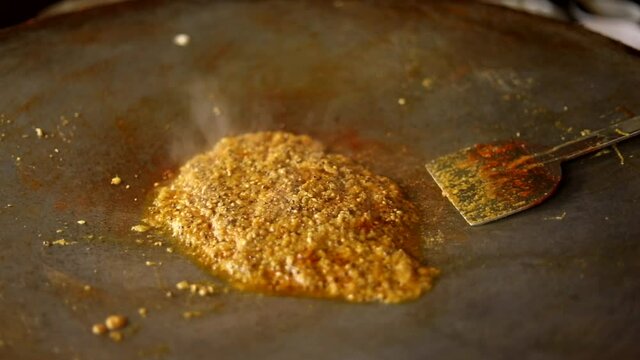 Making indian red gravy stuffing with peas for vada pav and bhaji.