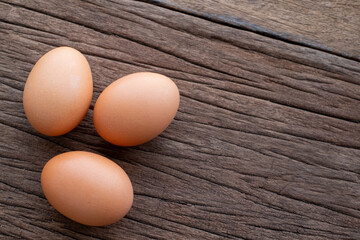 Chicken Eggs on wooden background. easter