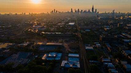 4k aerial drone footage of Chicago skyline during sunrise early morning with light fog rolling...