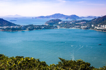 Fototapeta na wymiar Pacific Ocean view from Hong Kong Mountains during the hiking on Dragons back hiking path near Shek O
