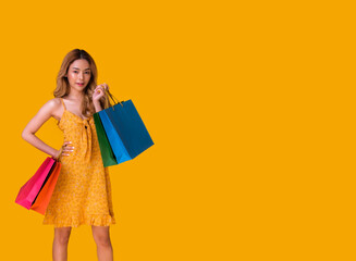 Cute Asian girl shopping for sale.She bought a lot of products from the discounted price.