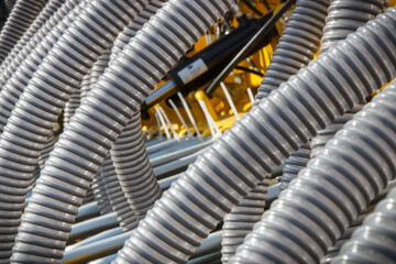 Plastic corrugated pipes in agricultural or industrial machinery. Part of hydraulic or pneumatic equipments