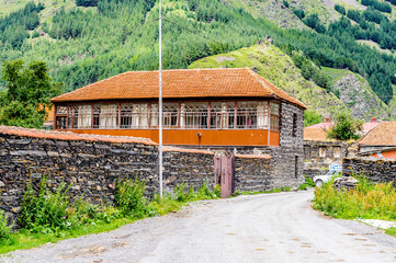 Fototapeta na wymiar It's House in the field and mountains