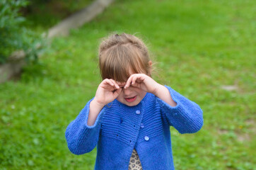 Emotional caucasian child in nature outdoor lifestyle