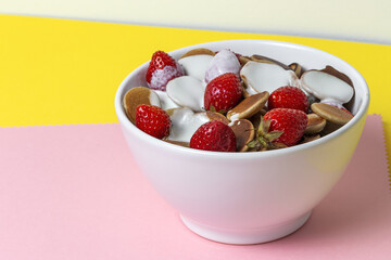 Homemade cereals mini pancake with yogurt, honey and strawberries on colorful background.