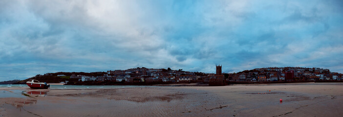 panoramic view of the scenic fishing town St. Ives, Cornwall UK at sunset