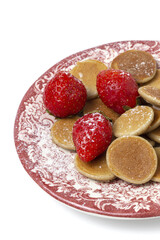 Homemade cereals mini pancake with yogurt, honey and strawberries on colorful background.