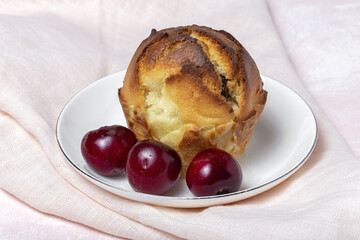 Homemade muffins with red berries and cherries