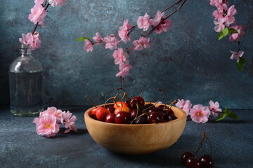 Sweet red cherries in a wooden bowl. Summer sweet dessert