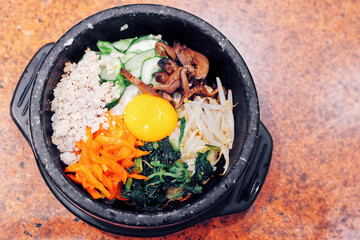 Bibimbap, Korean colourful food with egg, pork, mushroom, vegetable and rice