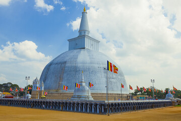 The ancient  Ruwanveliseya Dagaba close-up on a cloudy day. Anuradhapura, Sri Lanka