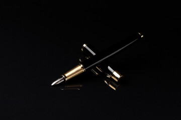fountain pen on a black background