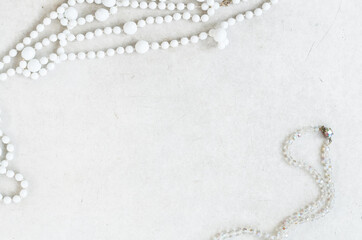 white beads on the grey surface of the table