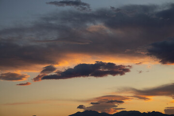 Fototapeta na wymiar amazing sunset and fluffy clouds background