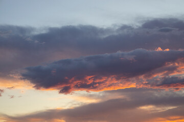 amazing sunset and fluffy clouds background