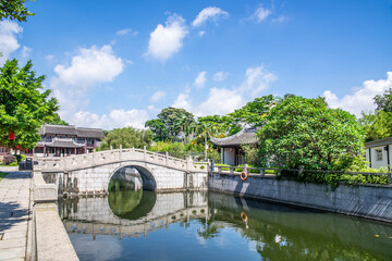Fototapeta na wymiar Stone arch bridge in a street in the water town of Nansha, Guangzhou, China