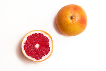 fresh sliced grapefruit on white background