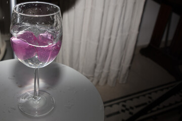  glass with ice cubes on white background