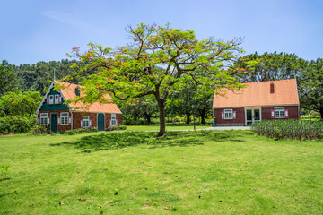 Two colored cabins on the big lawn