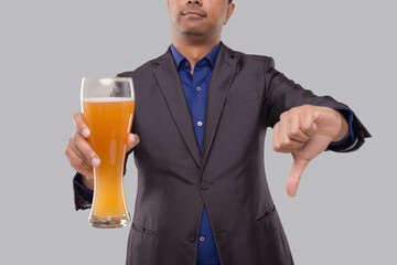 Businessman Showing Beer Glass and Thumb Down. Indian Business man with Beer in Hand Close Up