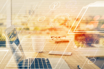 Double exposure of desktop computer and technology theme hologram. Concept of software development.
