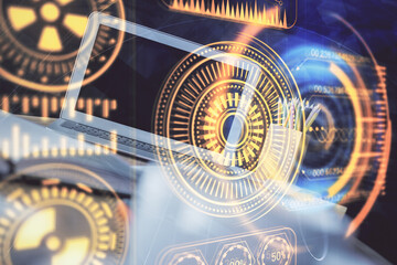 Computer on desktop in office with technology theme hologram. Multi exposure. Tech concept.