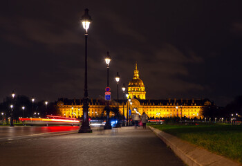Fototapeta na wymiar Paris night walk . Famous Invalides Cupola illuminated in the night 
