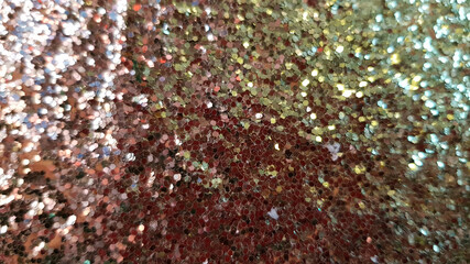 Christmas abstract background texture. Golden blurred background of small shiny glitter