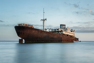 Shipwreck at the sunset on a Lanzarote coast with copy space