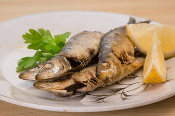 roasted or fried sardines on the plate
