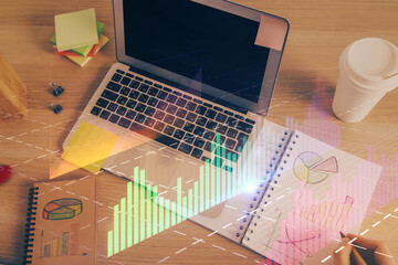Double exposure of man's hands writing notes of stock market with forex chart.