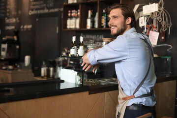 Small business owner working at his cafe.
