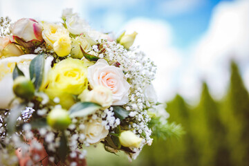 Delicate wedding bouquet of pink roses and peonies