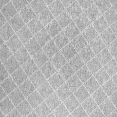 Fototapeta premium Gray fabric with diamond stitching pattern texture background