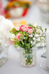 Delicate wedding bouquet of pink and white roses