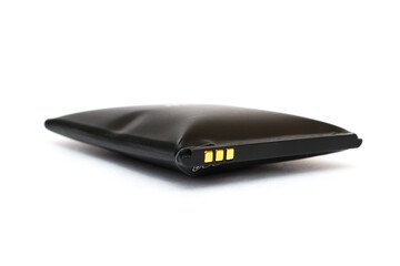 swollen battery from a mobile phone on a white background