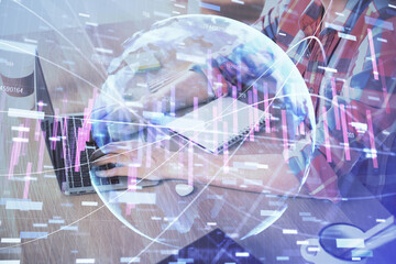 Multi exposure of forex graph with man working on computer on background. Concept of market analysis.