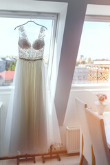 Beautiful wedding dress on a hanger