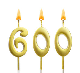 Golden birthday candles isolated on white background, number 600	